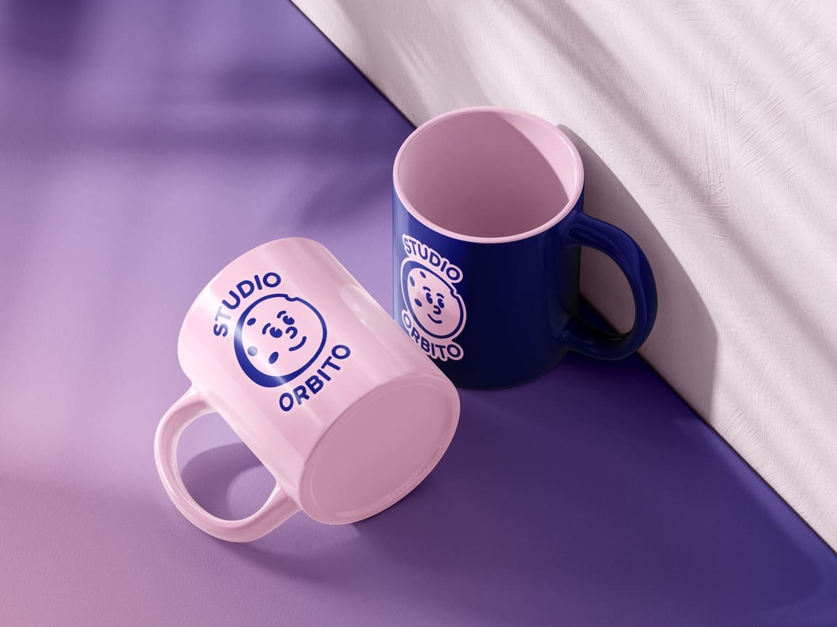 Logo personal branding on a pair of mugs